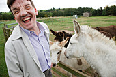 Man with learning disability on trip to farm with donkeys