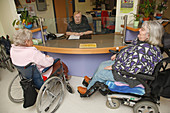 Receptionist with wheelchair users