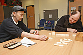 Men with disabilities playing dominoes