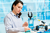 Student in CNC and robotics laboratory