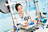Technician working on 3D printer