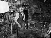 Blacksmith, Southrop, Cotswolds, Gloucestershire, UK, 1938
