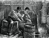 Grinders at work on a wheel, c1880