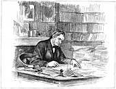 Thomas Henry Huxley, British biologist, at his desk in 1882