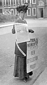 Miss Kelly selling Votes for Women in central London, 1911