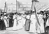 Suffragettes carrying banners to Women's Sunday, 1908