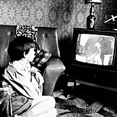 Boy watching television in a London house, c1950s