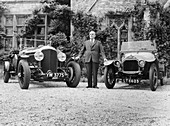 WO Bentley standing between two of his cars