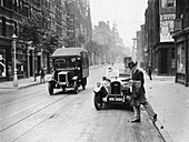 A Rover 1928 sports car parked in a London street, 1931