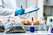 Soil scientist taking notes in laboratory