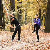 Cheerful couple stretching after jogging