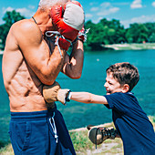 Grandfather and grandson boxing