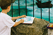 Boy drawing a seal