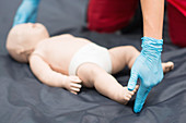 CPR training on baby dummy