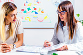 Nutritionist with female patient