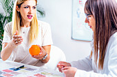 Nutritionist with female patient