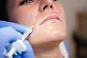 Woman having hyaluronic acid injections