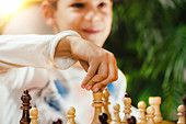 Boy playing chess at home