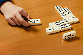 Boy playing dominoes