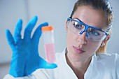 Scientist holding liquid sample