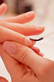 Woman having manicure