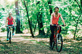 Two women cycling together