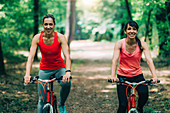 Two women cycling together