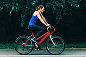 Woman cycling in a park