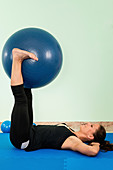 Woman exercising with a fitness ball