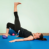 Woman exercising with a fitness ball
