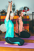 Senior woman in private yoga class