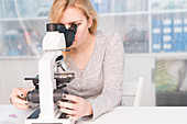 Student using microscope