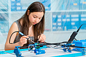 Girl working on robotics project