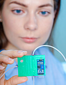 Researcher with lab on a chip