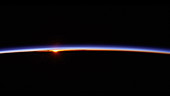 Sun rising through the atmosphere, from orbit