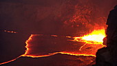 Lava spattering at night