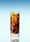 Glass of whisky and cola with slice of lime, illustration