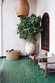 Green herringbone floor tiles on Oriental-style terrace