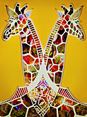 Paper collage of two symmetrical giraffes, illustration