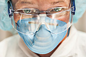 Scientist wearing safety goggles and mask