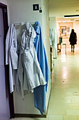Blouses of hospital staff on a coat rack