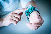 Woman taking her blood pressure