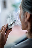 Woman using electronic cigarette