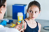 Young girl receiving Gardasil vaccination