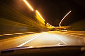 Car driving on road at night