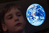 Boy looking at the Earth