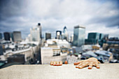 Man hanging on to building ledge