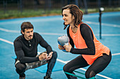 Personal trainer with female client