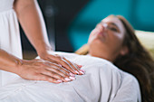 Hands at reiki healing treatment