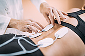 Physical therapy with TENS machine